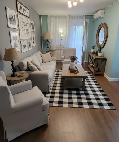 Dnevna soba s namještajem i zeleno-sivim zidovima