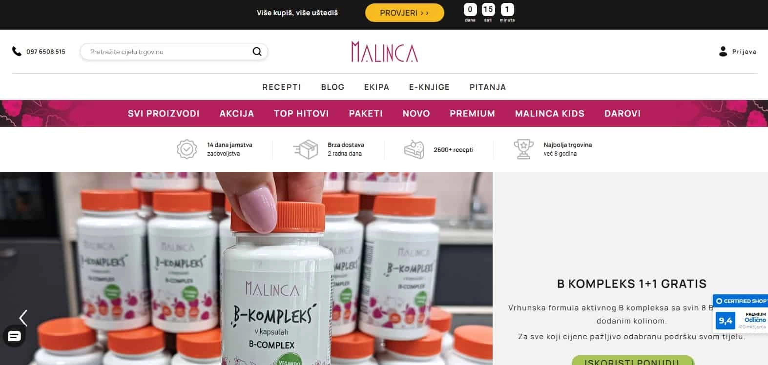 Ruka drži Malinca B-Kompleks bočicu ispred više bočica