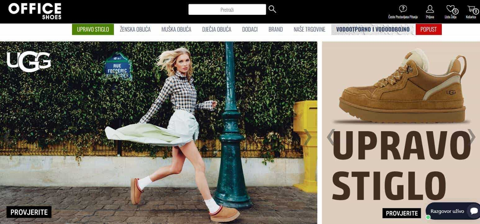 Žena hoda ulicom u UGG obući pored ulične svjetiljke